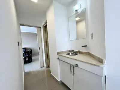 a bathroom with a sink and a mirror at Victoria Tower Category Department in Villa Carlos Paz