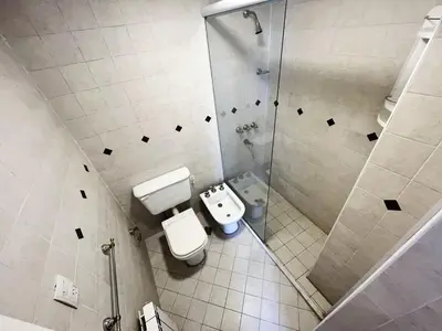 a bathroom with a toilet and a shower at Victoria Tower Category Department in Villa Carlos Paz