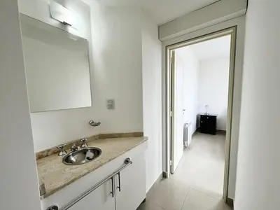 a bathroom with a sink and a mirror at Victoria Tower Category Department in Villa Carlos Paz