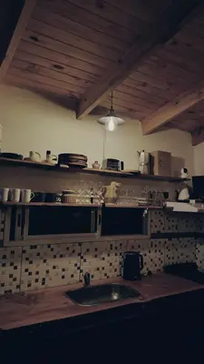 a kitchen with a sink and a counter top at Cabaña El Bordoneo in Villa Yacanto