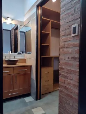 a bathroom with a sink and a mirror at Rincón Serrano in Villa Carlos Paz