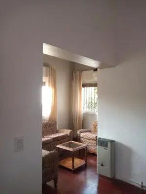 a living room with a couch and a table at Casa Josefina in Merlo