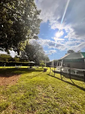 a field with a fence and a trailer at Hotel Mundial in Merlo
