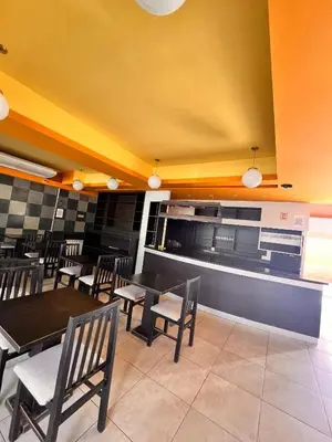 a dining room with tables and chairs in a restaurant at Hotel Mundial in Merlo