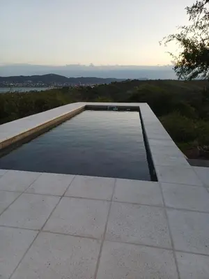 a swimming pool on the roof of a house at El Descanso in Villa Santa Cruz del Lago