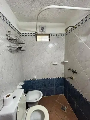 a bathroom with a toilet and a sink at casa kant in Villa Carlos Paz