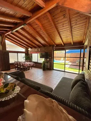 a living room with a couch and a table at casa kant in Villa Carlos Paz