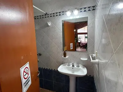 a bathroom with a sink and a mirror at casa kant in Villa Carlos Paz