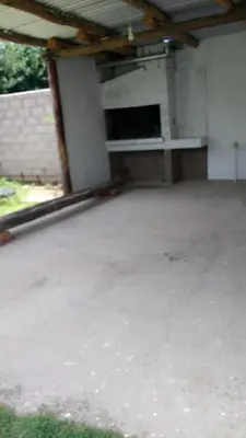 an empty parking lot in a building with a garage at Los Duraznos in Villa Cura Brochero