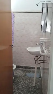 a bathroom with a sink and a toilet at Los Duraznos in Villa Cura Brochero