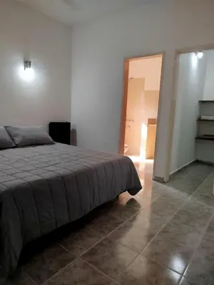 a bedroom with a bed and a tile floor at DonPedro in Los Hornillos