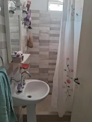 a bathroom with a sink and a shower curtain at Cerro blanco in Villa Carlos Paz