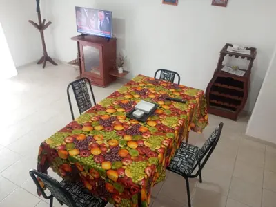 a table with a bunch of fruit on it at Tu Refugio Urbano, Confort a metros de la terminal in Villa Carlos Paz