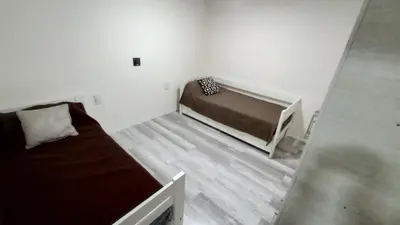 a small bedroom with a bed in a room at Chalet Arredondo Villa Carlos Paz in Villa Carlos Paz