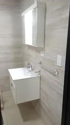a bathroom with a white sink and a mirror at Chalet Arredondo Villa Carlos Paz in Villa Carlos Paz