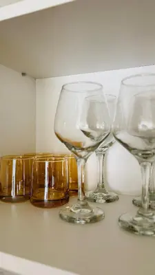 a group of wine glasses sitting on a counter at Departamento centrico amoblado in Río Cuarto
