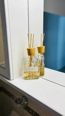 two glass jars sitting on a counter next to a microwave at Departamento centrico amoblado in Río Cuarto