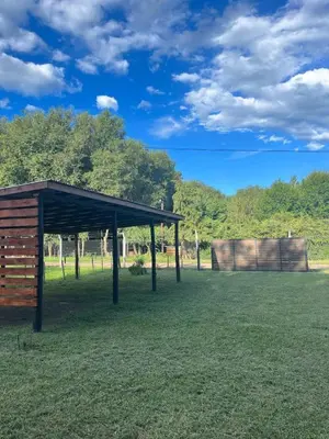 a pavilion in the middle of a grass field at Ideal para parejas en Anisacate in Villa Anizacate