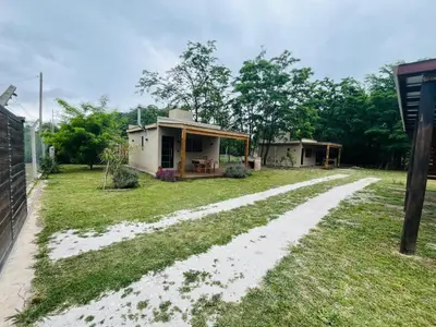 a house with a dirt road in front of it at Ideal para parejas en Anisacate in Villa Anizacate