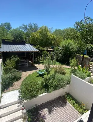 an aerial view of a garden with a table at Calamuchita Apart Dos Talas in Santa Rosa de Calamuchita