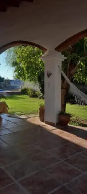 an entrance to a house with an archway at En lo de Ana in Villa Dolores