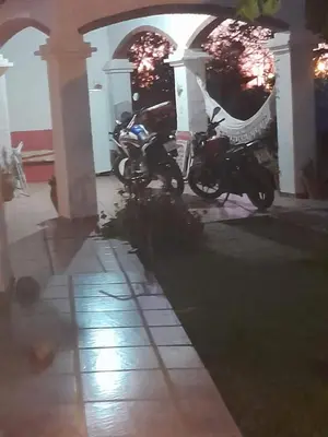 a couple of motorcycles parked in a building at En lo de Ana in Villa Dolores