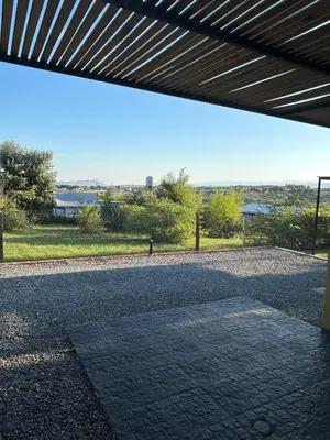 a view from under a roof of a brick road at HERMOSO DEPARTAMENTO en COMPLEJO CERRADO in Estancia Vieja