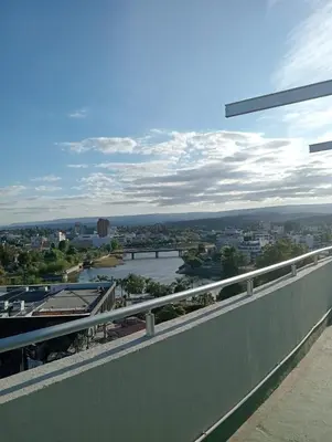 a view of a river from a balcony at Constantino Villa Carlos Paz departamento céntrico in Villa Carlos Paz