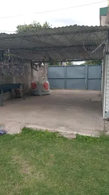 a parking lot with a picnic table and a fence at Azulina in Alta Gracia