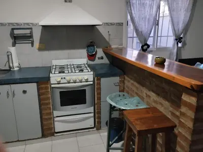 a kitchen with a stove and a counter top at Azulina in Alta Gracia