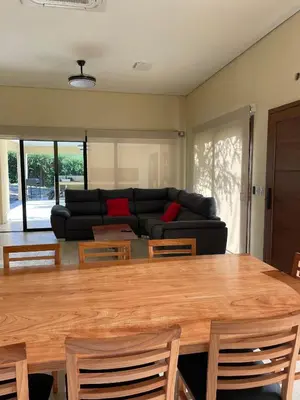 a living room with a table and a couch at La Madriguera de Potrerillo in Alta Gracia