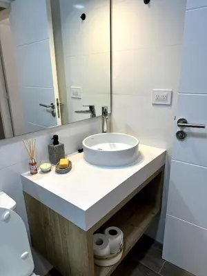 a bathroom with a sink and a mirror at Nva Cba, Calle Rondeau in Cordoba