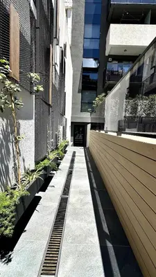 a hallway of a building with plants on it at Nva Cba, Calle Rondeau in Cordoba