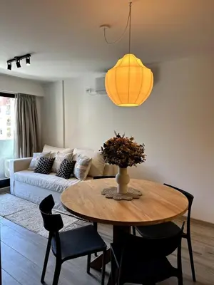 a living room with a table and a couch at Nva Cba, Calle Rondeau in Cordoba