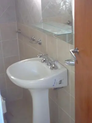 a bathroom with a sink and a mirror at Sierras y sol in Villa Cura Brochero