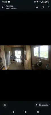 a picture of a living room and a kitchen at Cabaña Flor Serrana in Tanti