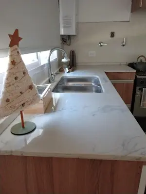 a kitchen with a christmas tree on a counter at Selene in Villa Rumipal