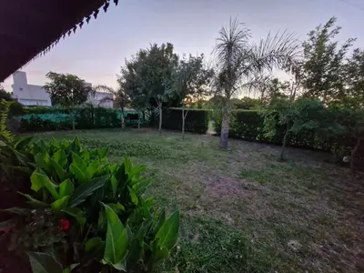 a yard with trees and bushes and a fence at Casa Runa Kay in Almafuerte
