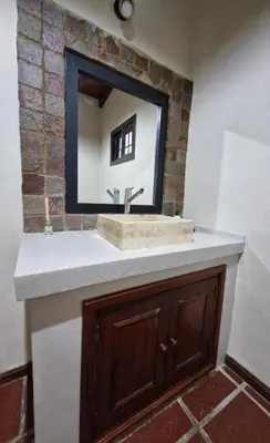a bathroom with a sink and a mirror at Casa Runa Kay in Almafuerte