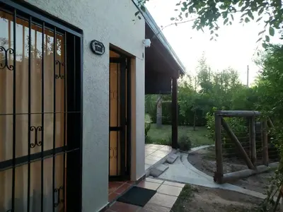 an open door of a building with a gate at Casa Runa Kay in Almafuerte
