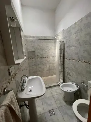 a bathroom with a sink and a toilet and a shower at Cabañas Nuevos Elefantes in Villa Cura Brochero