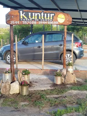 a sign for a kulturearmaarmaarmaarmaarmaarmaarmaarmaarmaarma at Kuntur Casas de Campo in Mina Clavero
