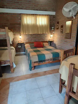 a bedroom with a bed in a room at Cabañas del IntiCo in Arroyo de Los Patos