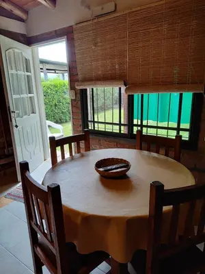 a dining room table with a bowl on top of it at Cabañas del IntiCo in Arroyo de Los Patos
