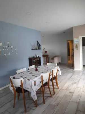 a dining room with a table and chairs at Casa con encanto serrano in Villa General Belgrano