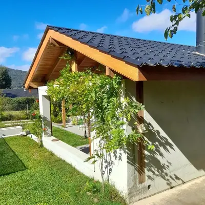 a house with a black roof at Casa con encanto serrano in Villa General Belgrano