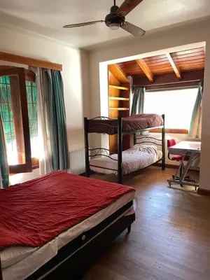 a bedroom with two beds and a ceiling fan at perfecta casa en Cordoba in Cordoba
