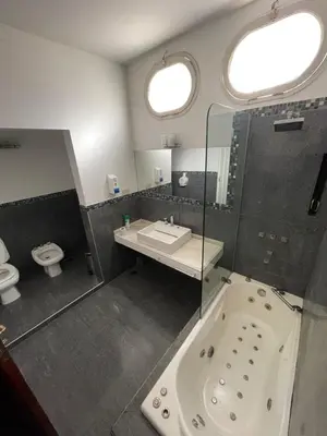 a bathroom with a tub and a sink and a toilet at perfecta casa en Cordoba in Cordoba