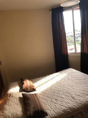 a bedroom with a bed with a window at Departamento Nuevo centro shopping in Cordoba