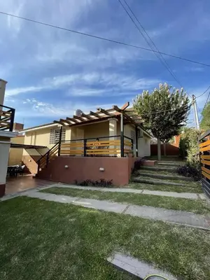 a house with a porch with a fence at CastelAnte1 in Villa Carlos Paz